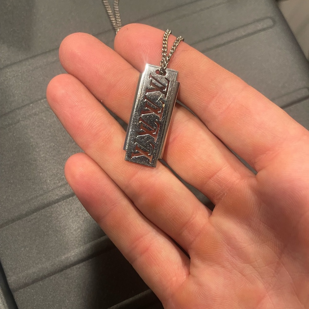 Louis Vuitton barber blade necklace .
